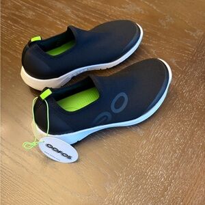 OOFOS Women’s Black and White Slip-On Shoes